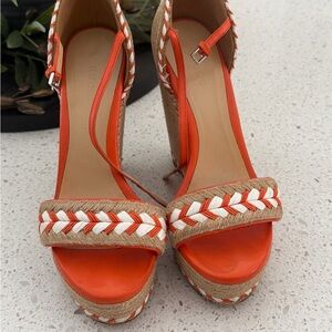 Gucci Orange and Tan Wedges. There are crafted of orange leather.